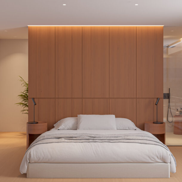 Minimalist master bedroom in a luxury villa in Begur, featuring warm wood paneling and integrated lighting.