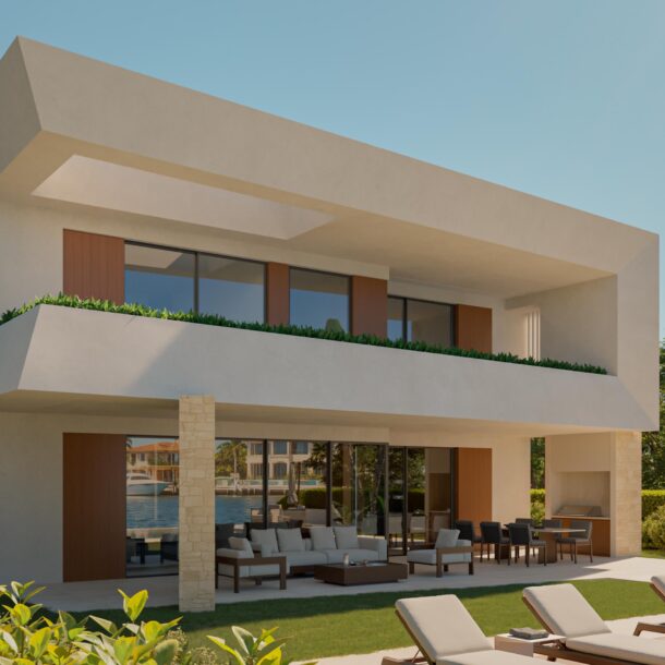 Luxury villa exterior with a pool, tropical landscaping, and outdoor seating in Cap Cana.