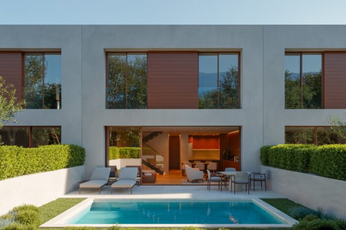 Modern façade with pool and garden in daylight at Mont-Ras
